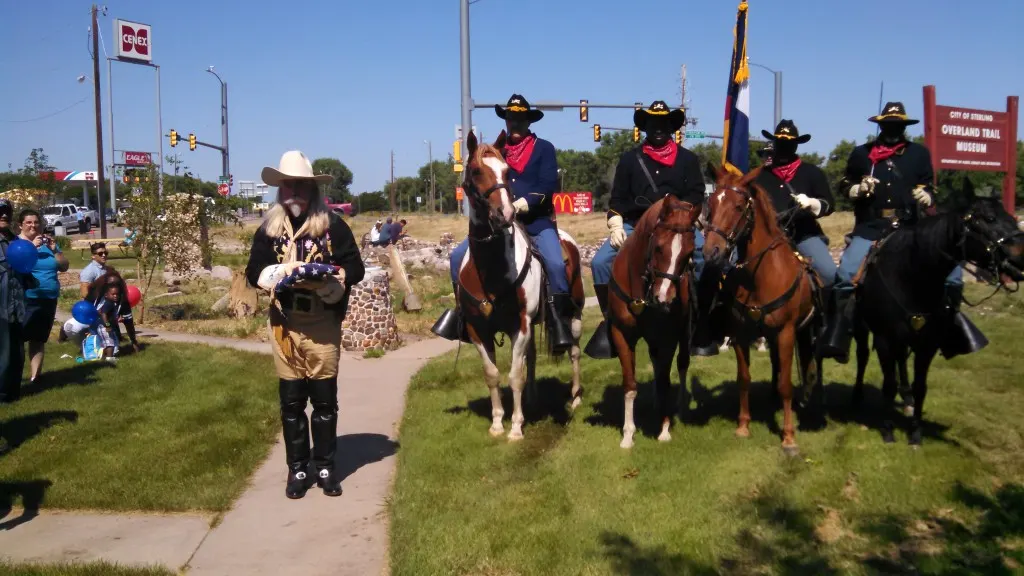 Buffalo Bill impersonator Gunny Jeff Norman recieving the American flag from the Buffalo Soldiers for the Independence Day opening ceremony